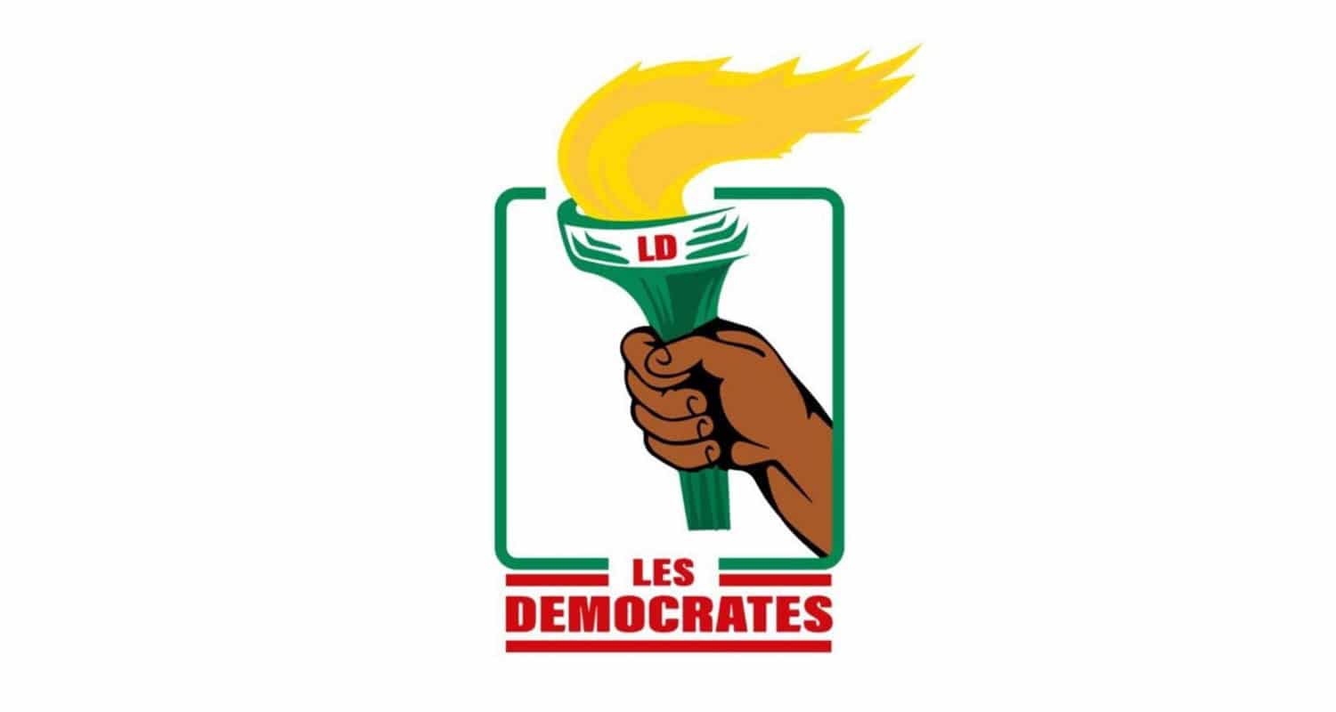 Une main tenant une torche allumée avec les lettres LD sur la poignée et le texte Les Democrates en dessous