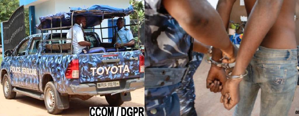 Arrestation d’un homme menotté par un agent en uniforme près d’un véhicule Toyota de la police nationale