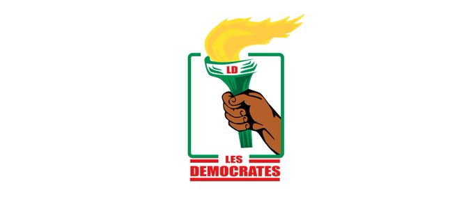 Une main tenant une torche allumée avec les mots LES DEMOCRATES inscrits en rouge en dessous